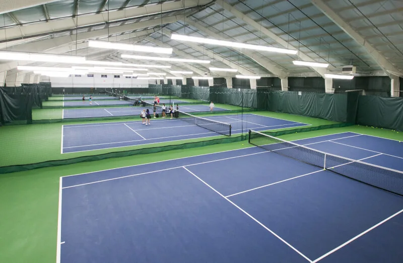 Indoor tennis courts at the Bay Club Greater Seattle campus