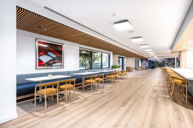Family game room with air hockey, foosball and skateboard wall art at Manhattan Country Club